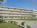 Three-storey building close to the main buildings.