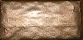 A photograph of the golden inner wrapper of a large Galaxy Bubbles bar.