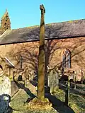 View of the Viking Cross and church, from the SW