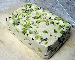Halva decorated with pistachios - Sweets - Syria