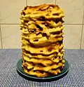 European spit cakes are baked around a metal cylinder.