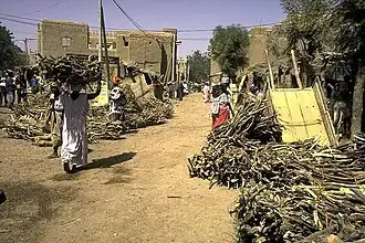 Image 42Selling firewood at a market (from Tree)