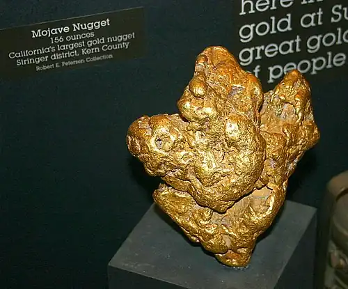 Using a metal detector in a Southern California desert, an individual prospector found this gold nugget, known as the Mojave Nugget, weighing 156 troy ounces (4.9&nbsp;kg).