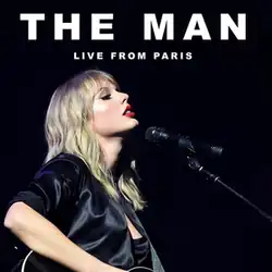 Swift near a microphone in front of a black background